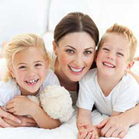 a mother and her two children dentists for your whole family oral solutions