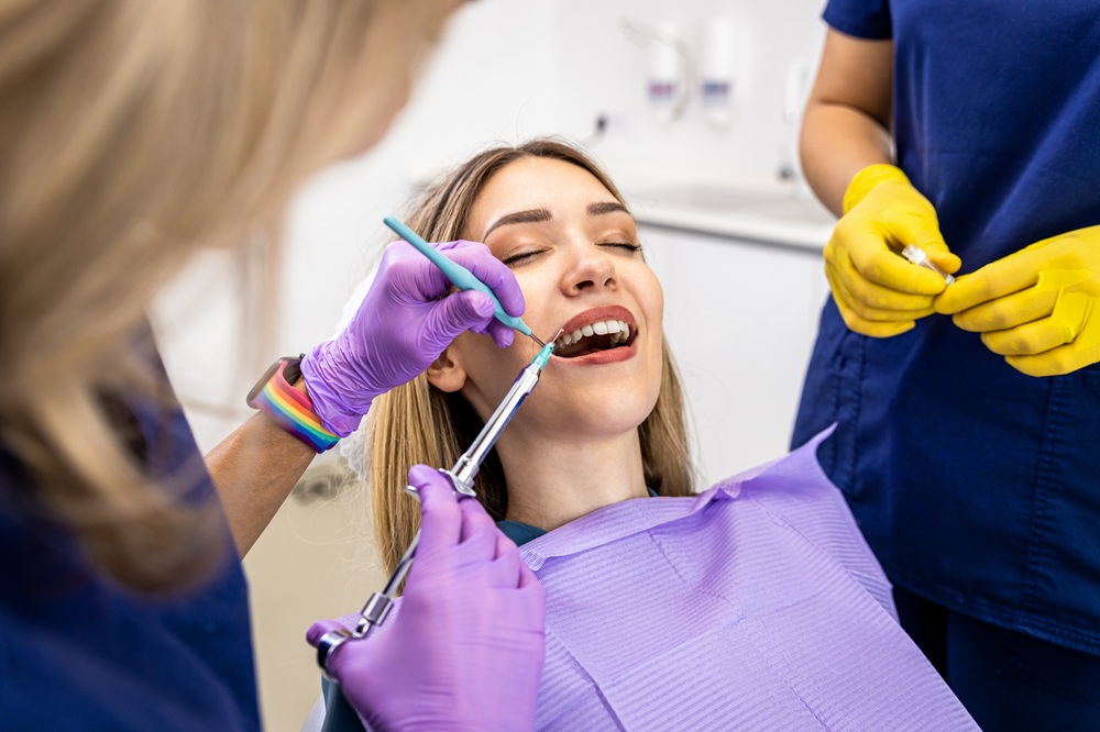 Emergency Dental Treatment, Emergency Dentist Prescott AZ Female patient receiving a dental anesthetic injection from a two-person dental team at Prescott Dental Arts in Prescott, AZ, representing prompt and comfortable emergency dental treatment